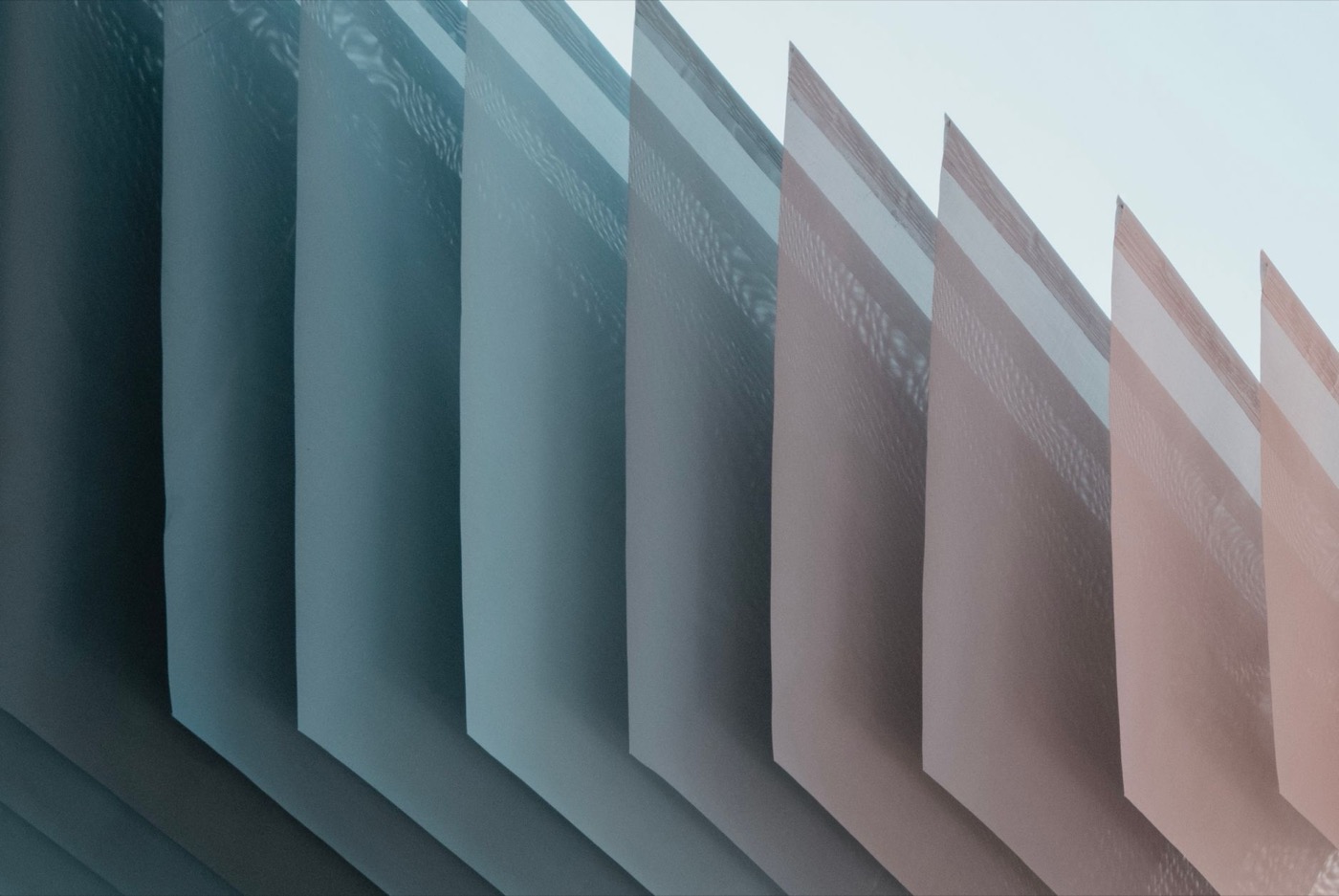 A modern architectural pattern with geometric shapes and gradient colors creating a minimalist and futuristic look.